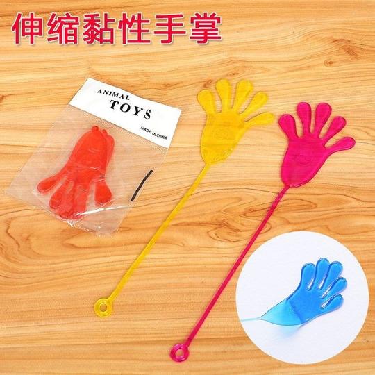 巴掌黏粘墙伸缩黏粘锤粘贴墙上儿时黏性弹性搞笑手掌玩具。怀旧