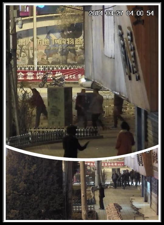 图为强达公司摄像头拍摄的3月27日商户将堆在门前的砖头扔向天水南路的视频。