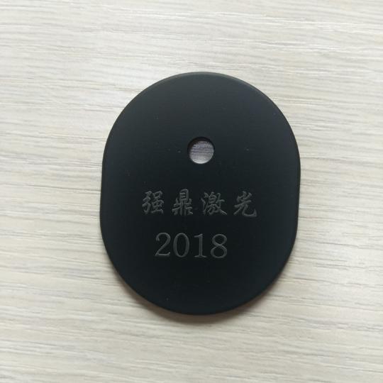 塑胶外壳激光打标，黑色材质塑胶外壳激光镭雕灰白色文字图案