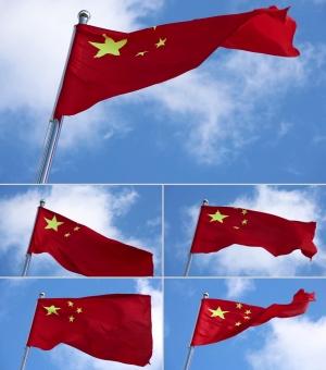 五星红旗迎风飘扬蓝天白云背景的实拍视频素材